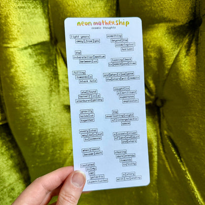 sheet of word bubble stickers held by a hand against a green background
