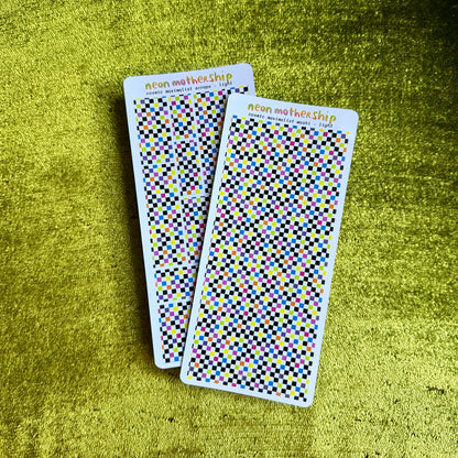 two checkered sticker sheets on a green background