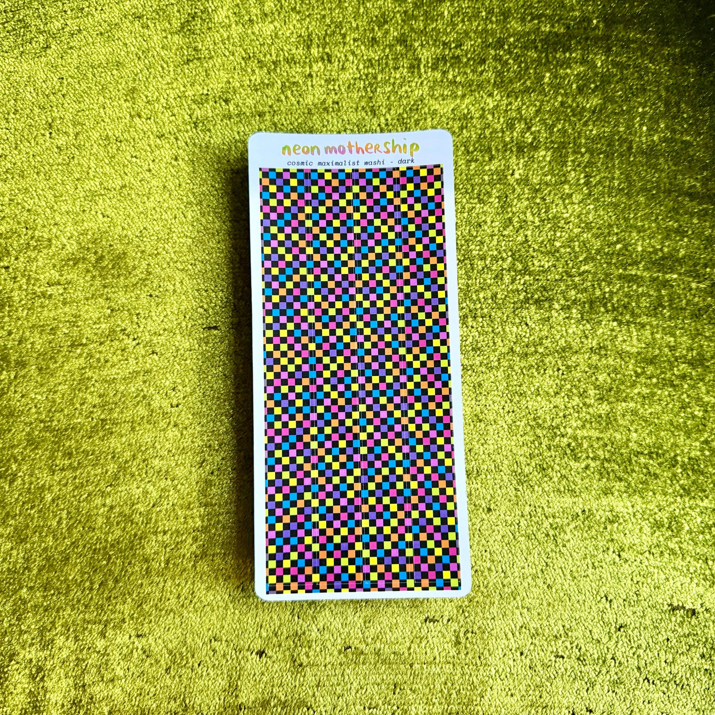 checkered sticker sheet on a green background