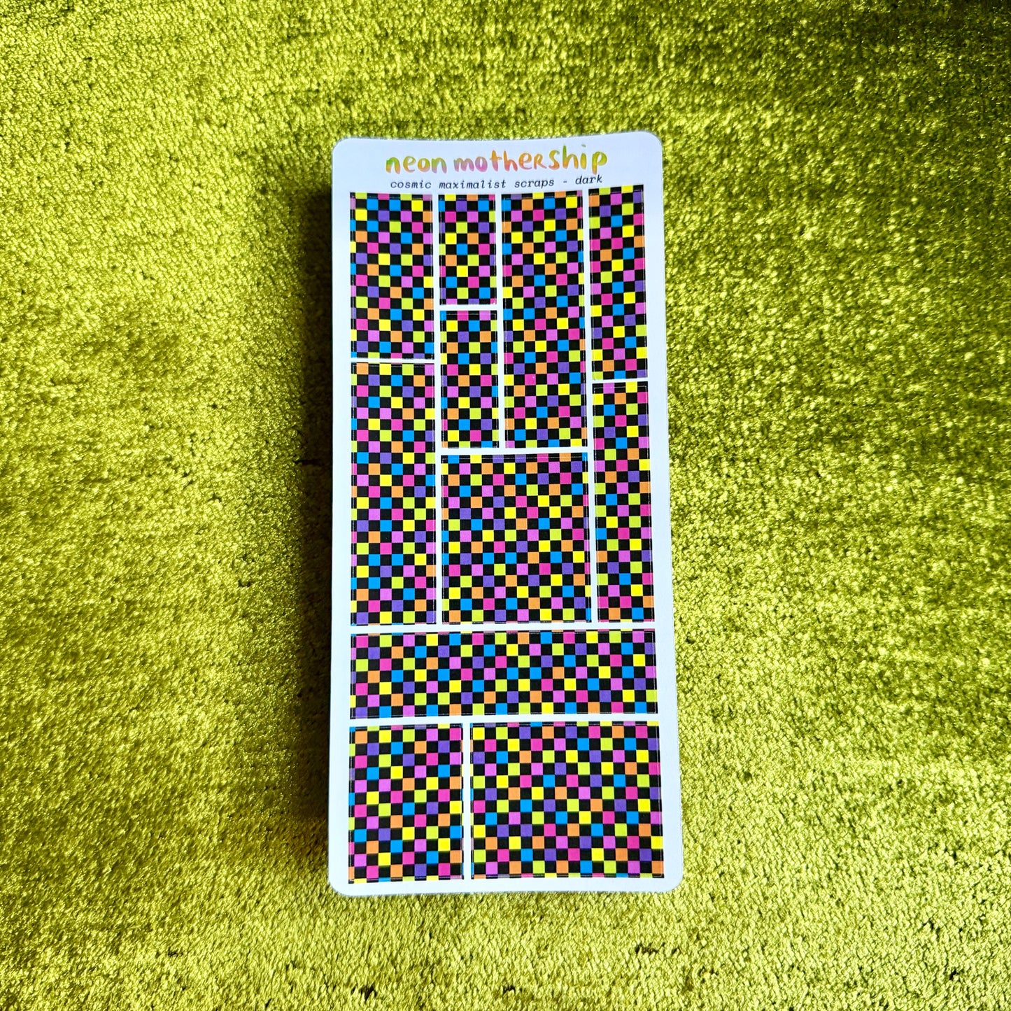 checkered sticker sheet on a green background