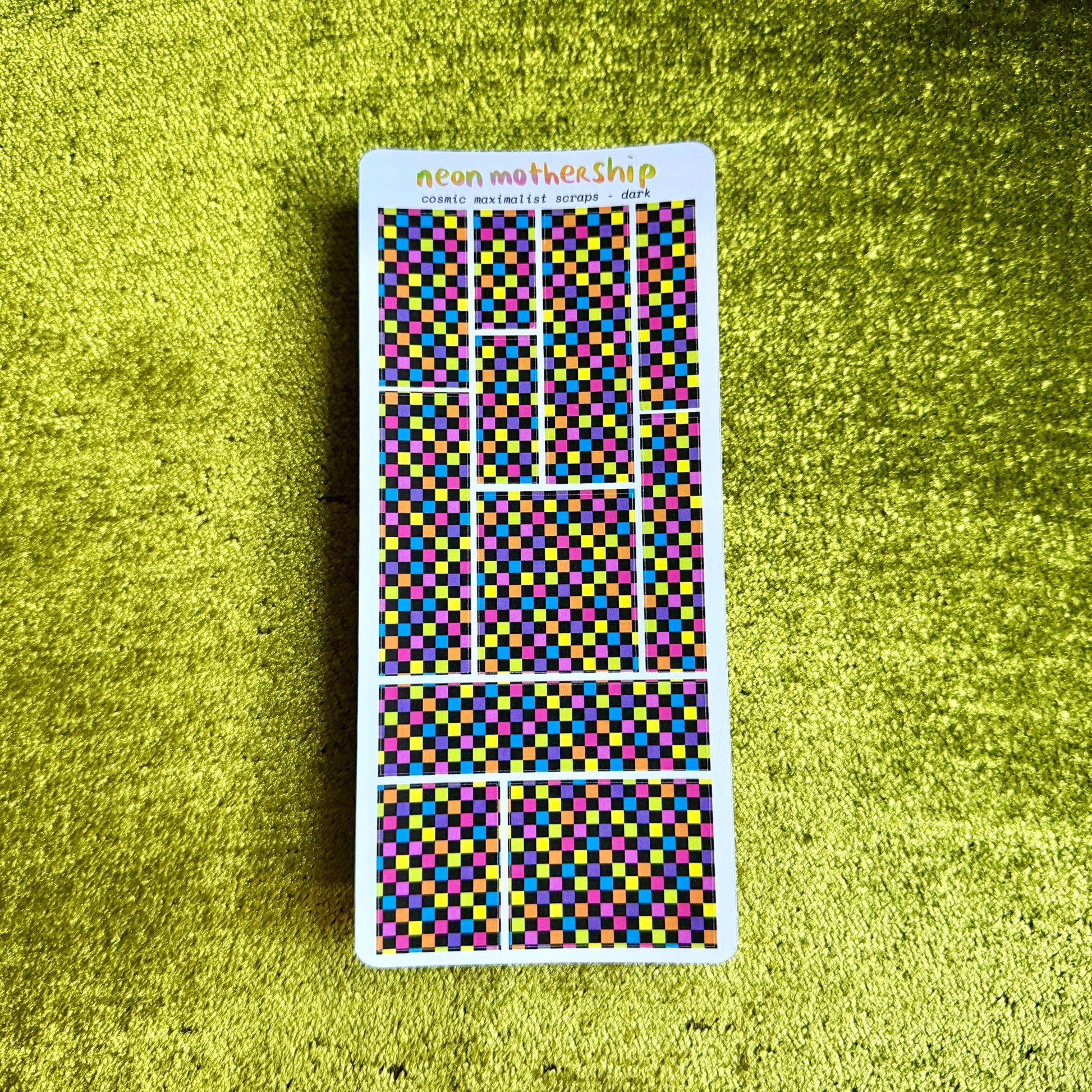 checkered sticker sheet on a green background