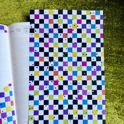 checkered sticker sheet on a journal page
