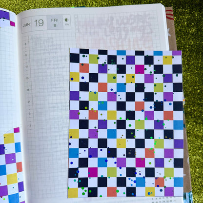 checkered sticker sheet on a journal page