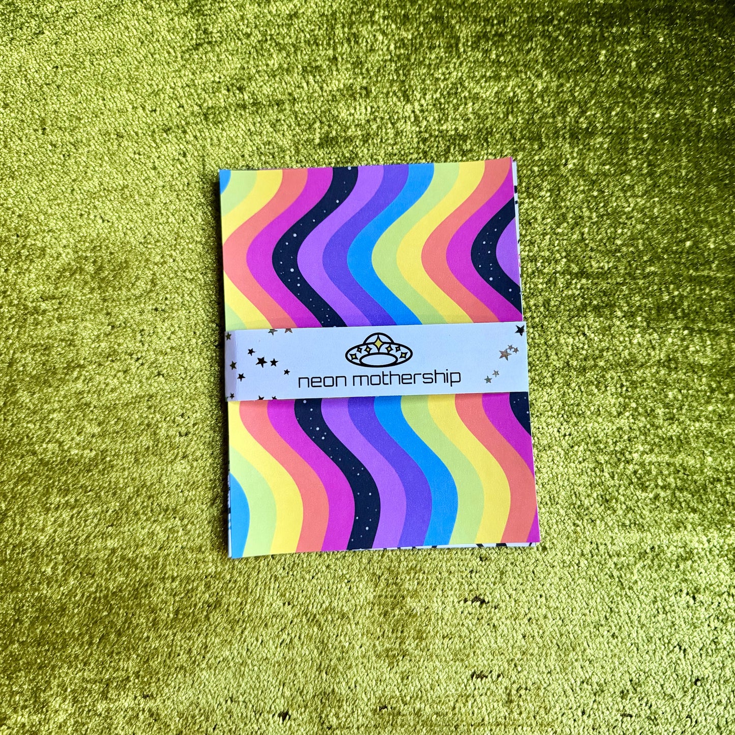colorful sticker paper on a green background