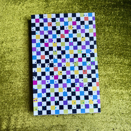 checkered sticker paper with holographic sparkles on a green background