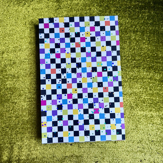 checkered sticker paper with holographic sparkles on a green background