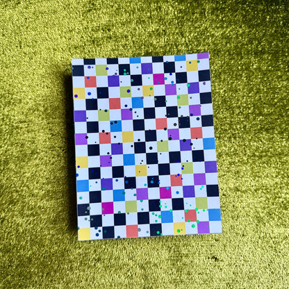 checkered sticker paper on a green background