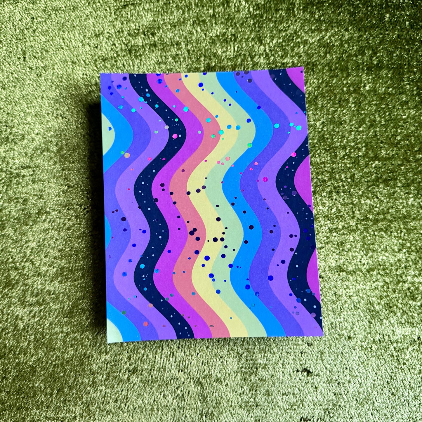 rainbow sticker paper on a green background