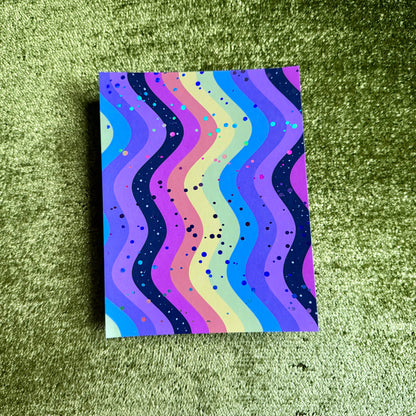 rainbow sticker paper on a green background