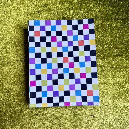 checkered sticker paper on a green background