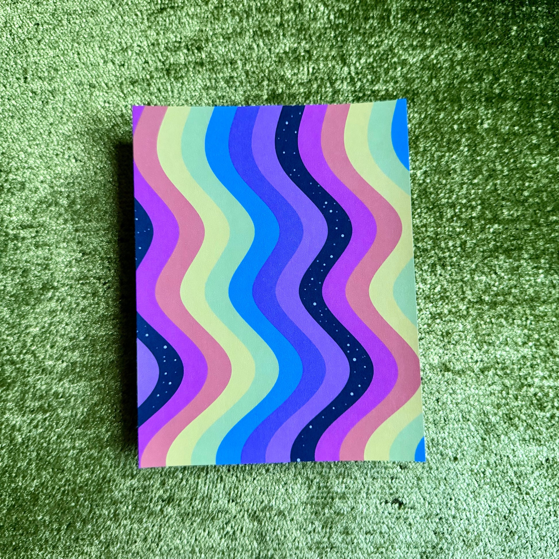rainbow sticker paper on a green background