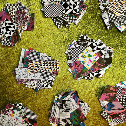 Collage of various patterned sticker scrap squares on a green surface