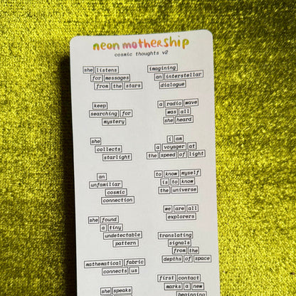 A white rectangular sticker sheet with the brand name 'neon mothership' at the top and multiple small black text labels arranged in a grid, placed on a textured yellow background.