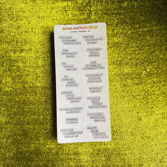 a sticker sheet with cosmic phrases on a green textured background