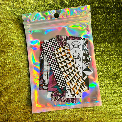 Holographic packaging with futuristic printed stickers on a green textured background