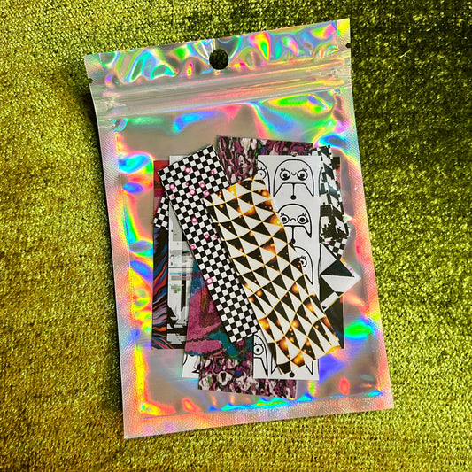 Holographic packaging with futuristic printed stickers on a green textured background