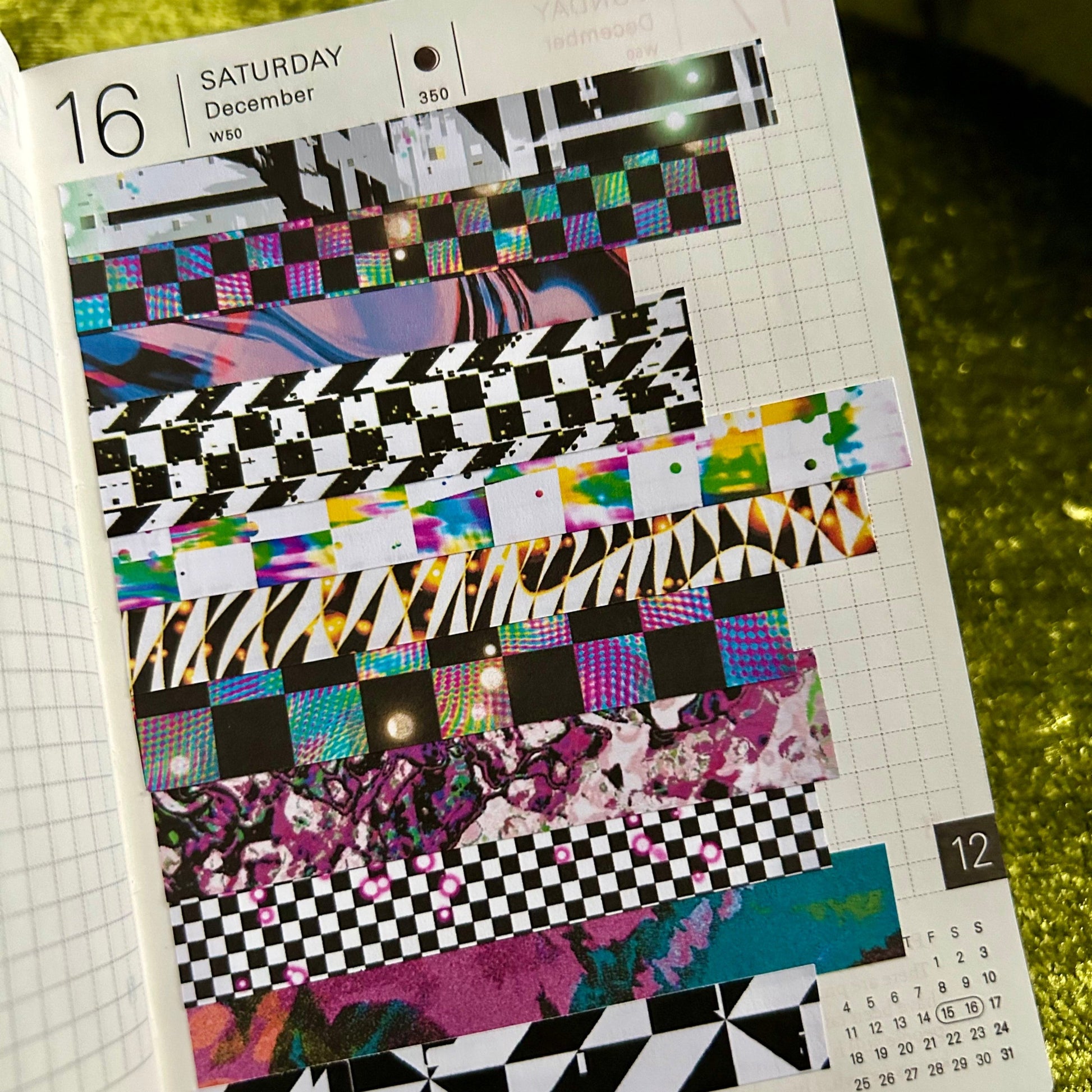 journal page with colorful abstract designs on a textured green surface