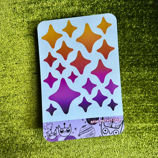 sticker sheet with star patterns on a green textured surface