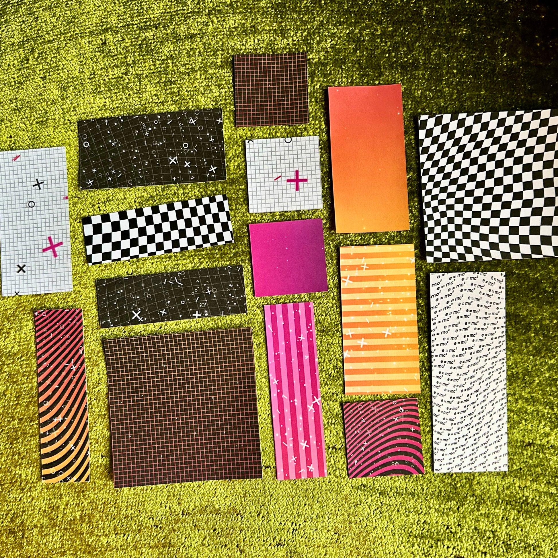 Collection of various patterned stickers on a grassy background