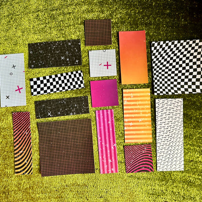 Collection of various patterned stickers on a grassy background
