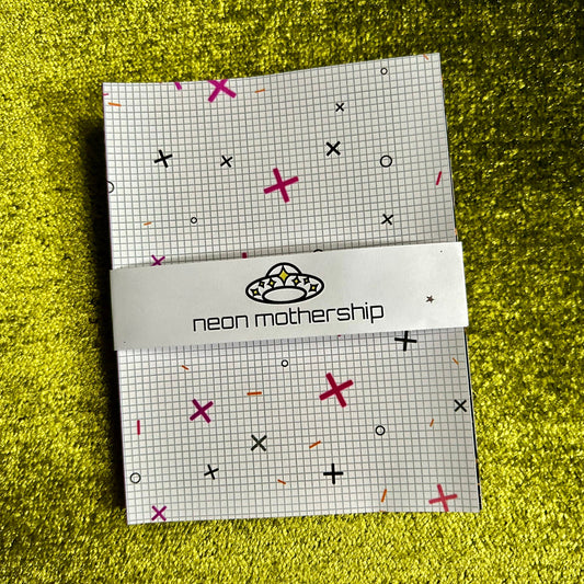 Pack of neon motherhood products with a patterned design on a green textured background