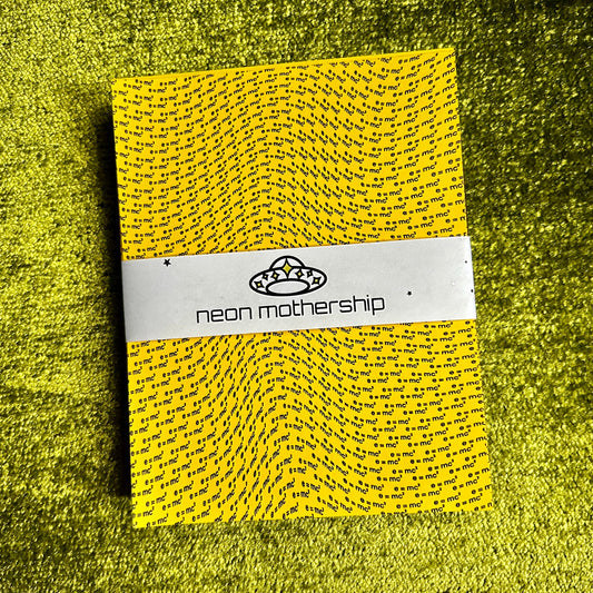 Yellow paper with a brand label on a green textured background