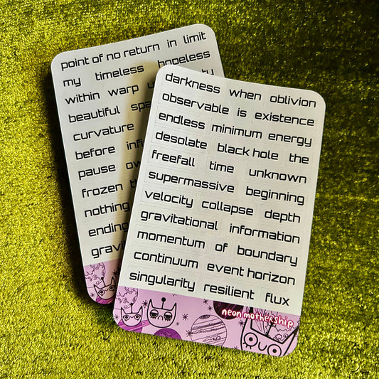 Two sticker sheets with text and graphics on a green textured surface