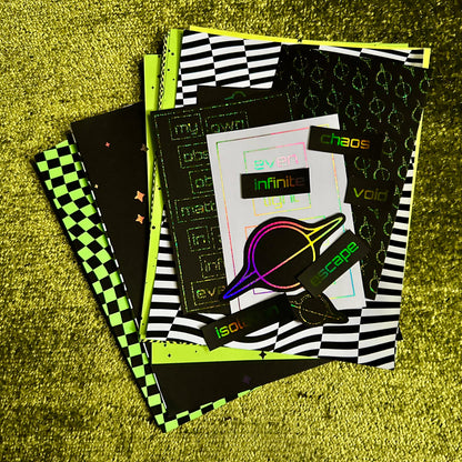 Stack of papers with various designs on a textured green surface
