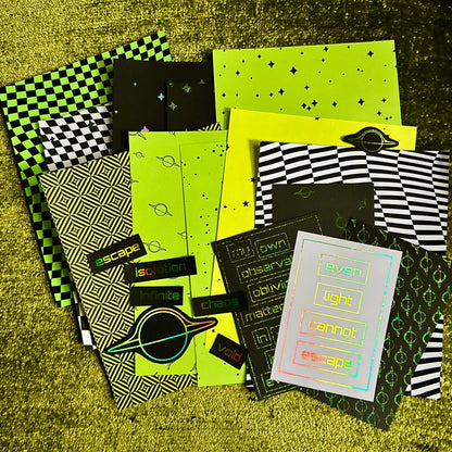 Collection of papers with various patterns on a textured green surface