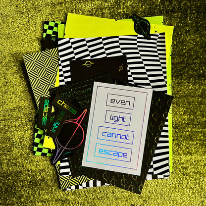 Collection of paper scraps with geometric patterns and text on a textured yellow surface