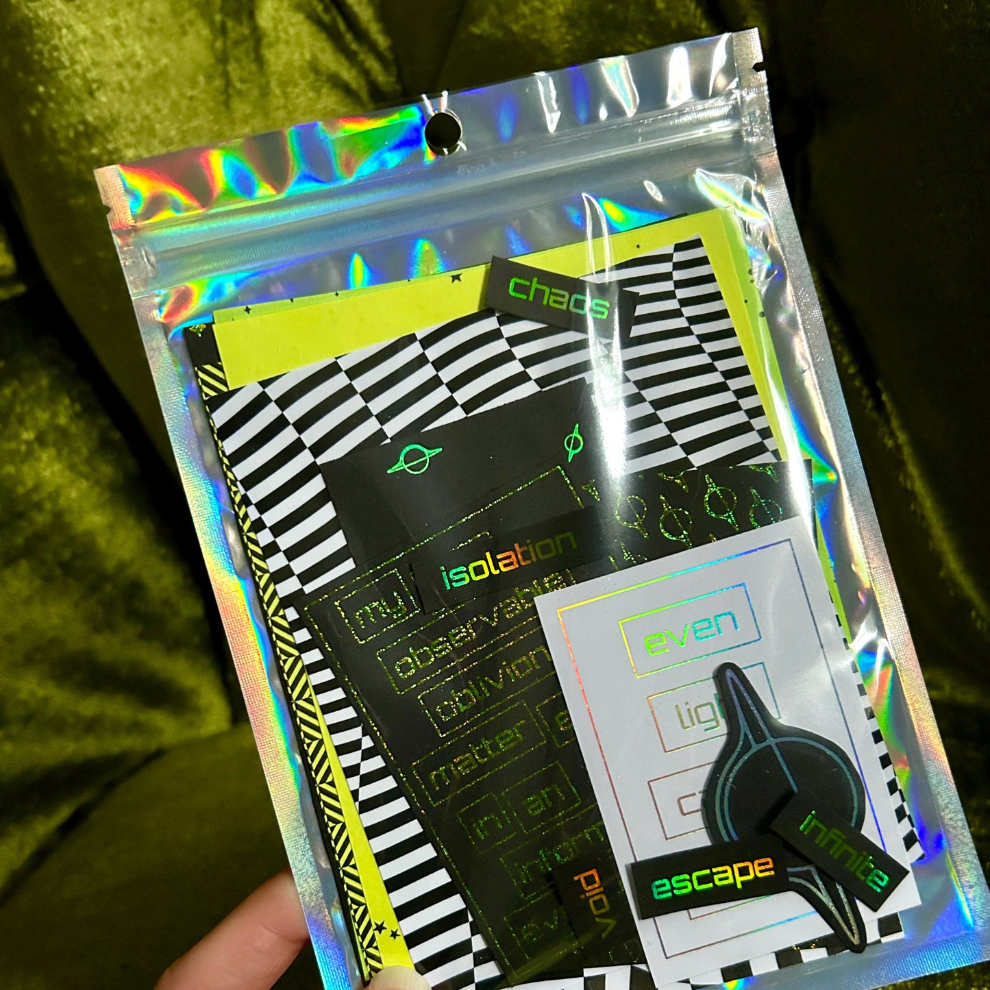 Holographic packaging with text and graphics on a green textured background