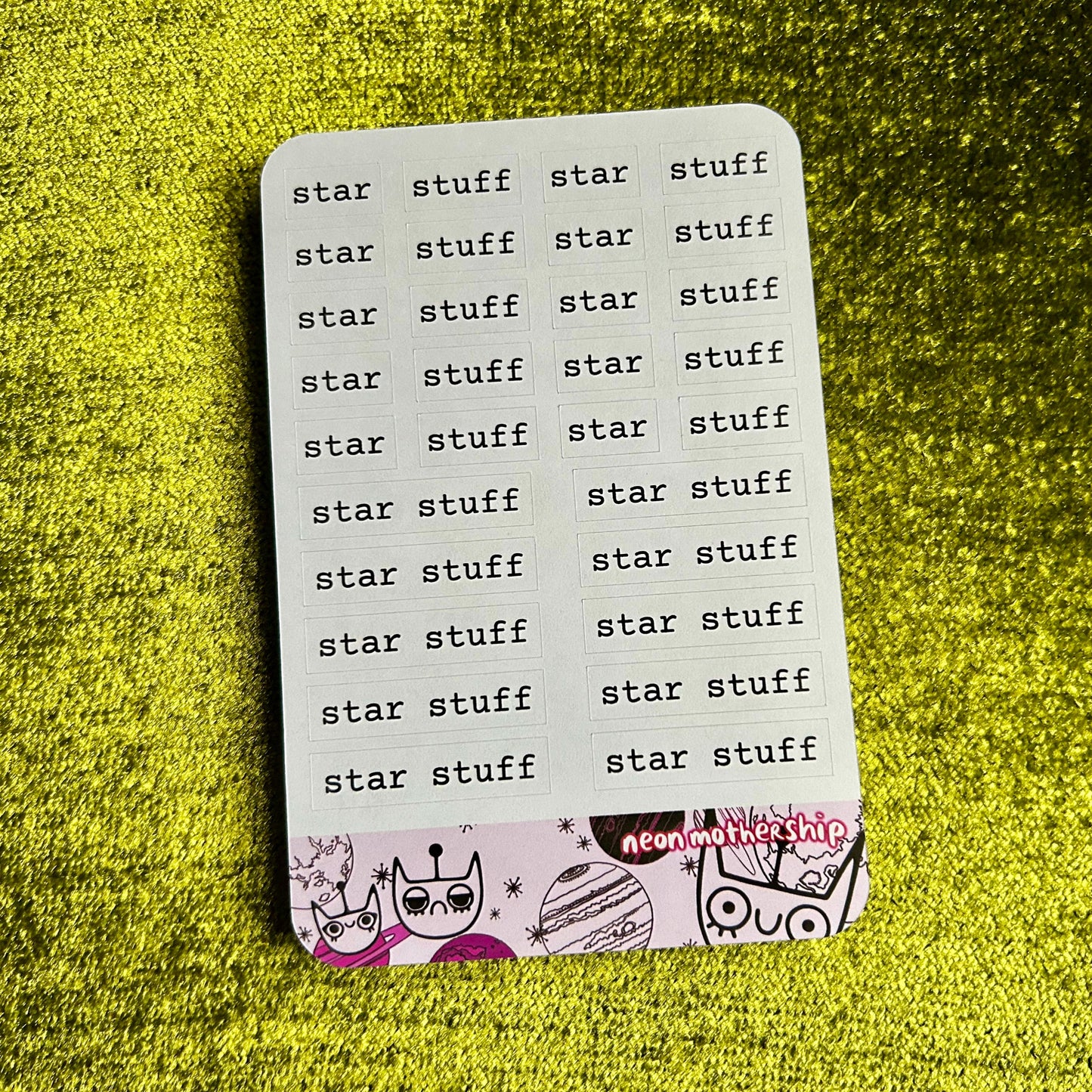 sticker sheet with 'star stuff' text on a green textured background