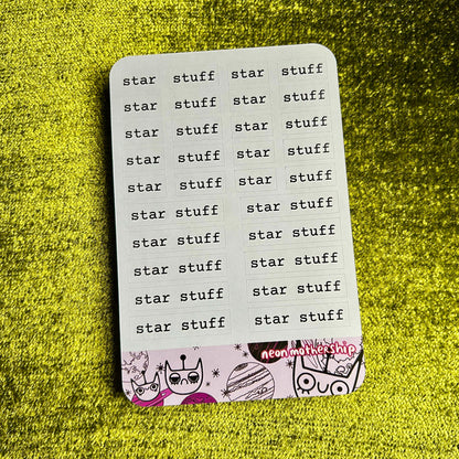 sticker sheet with 'star stuff' text on a green textured background
