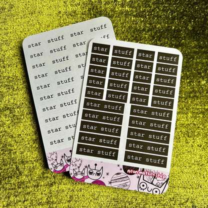 Two sheets of 'star stuff' stickers on a textured green surface