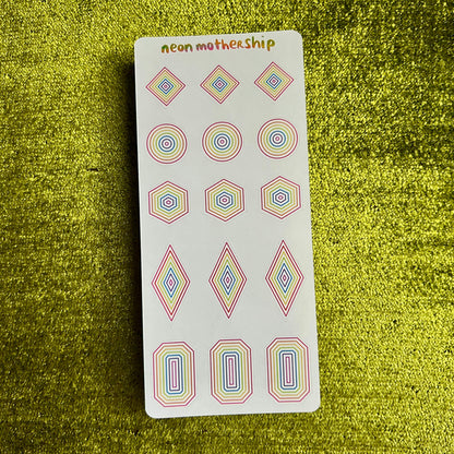 sticker sheet with geometric stickers on a green textured background