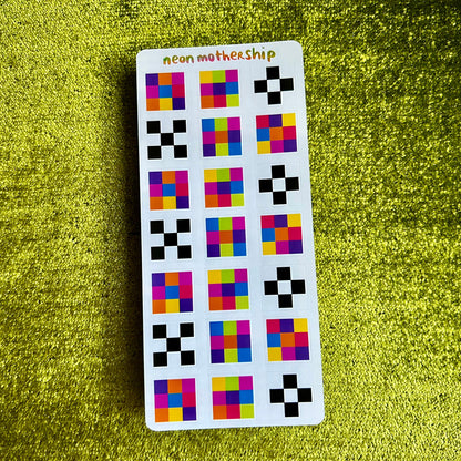Sticker sheet with colorful geometric patterns on a green textured background