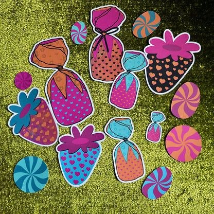 Colorful candy-themed stickers on a green textured background