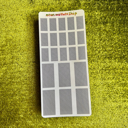 Rectangular sticker sheet with 'neon motherShip' branding on a green textured surface