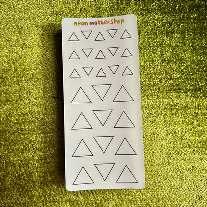 Sheet of triangle-shaped stickers with 'neon motherhip' branding on a green textured background